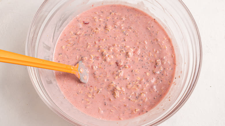 Bowl with strawberry milk, oats, and chia seeds