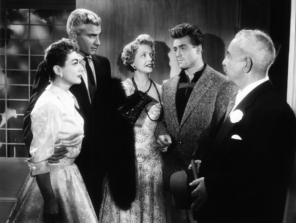 An uncredited Ed Fury (in tweed jacket) with Joan Crawford, Jeff Chandler, Natalie Schafer & Cecil Kellaway in ‘Female on the Beach’ (Everett Collection)