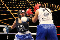 <p>Selina Herrera loads up a punch in the ring against Radwa Mohammed, right, during the NYPD Boxing Championships at the Theater at Madison Square Garden on June 8, 2017. (Photo: Gordon Donovan/Yahoo News) </p>