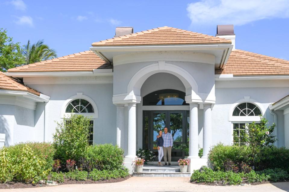 The Weathersbys in front of their handsome home. Melissa Sweredoski