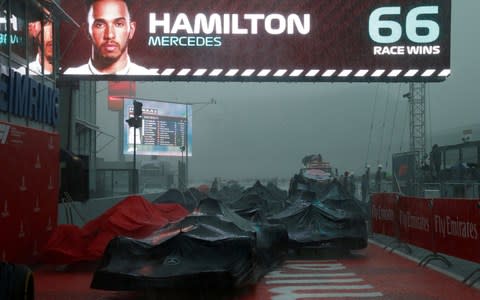 Formula One F1 - German Grand Prix - Hockenheimring, Hockenheim, Germany - July 22, 2018 Mercedes' Lewis Hamilton displayed on a screen after winning the race as rain falls on the track - Credit: reuters