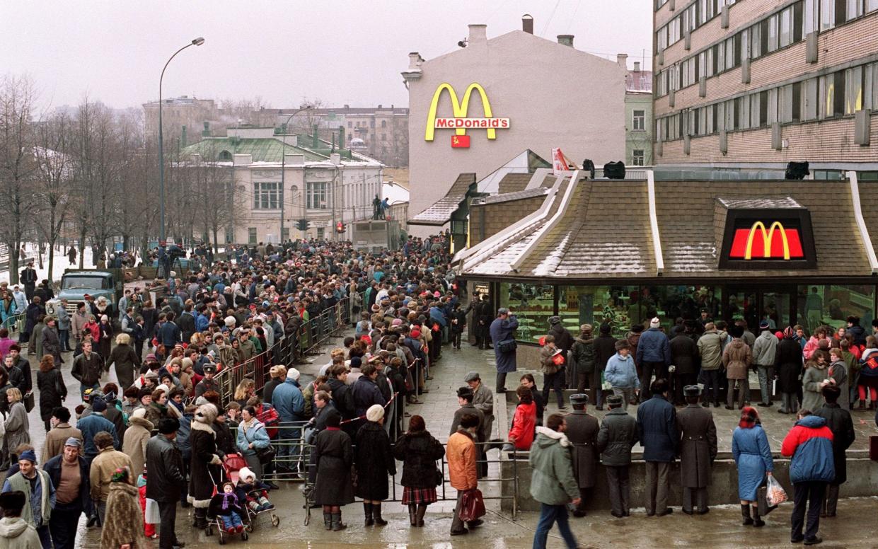 Muscovites queue round the block at the opening of the first McDonald's in Russia in 1990 - VITALY ARMAND/AFP