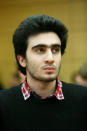 FILE PHOTO: Syrian refugee Anas Modamani attends a court session against Facebook over a selfie with Merkel at the district court in Wuerzburg, Germany February 6, 2017. REUTERS/Ralph Orlowski