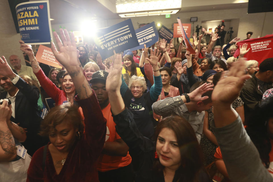 Democratic supporters cheer their candidates at a Democratic Party event in Richmond, Va., Tuesday, Nov. 5, 2019. All seats in the Virginia House of Delegates and state Senate are up for election. (AP Photo/Steve Helber)