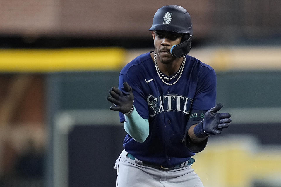 Seattle Mariners' Julio Rodriguez celebrates after hitting a double during the first inning of the team's baseball game against the Houston Astros, Friday, July 7, 2023, in Houston. (AP Photo/Kevin M. Cox)