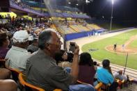 Fans attend a baseball game between Los Artesanos de Las Piedras and Los Halcones de Gurabo during the Puerto Rico Double A baseball league at Las Piedras, Puerto Rico, June 11, 2016. REUTERS/Alvin Baez