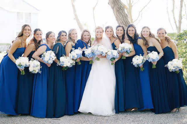 <p>Alex Gordias</p> Sarah Kennedy poses with her bridesmaids.