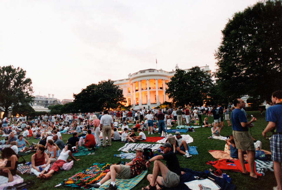 This photograph by Tina Hager shows White House staff and guests enjoying a Fourth of July celebration on the South Lawn, July 4, 2002.