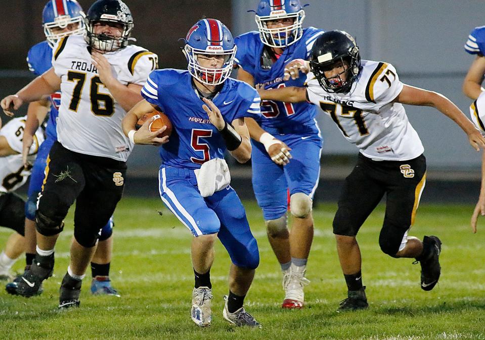 Mapleton High School's Kollin Cline (5) runs with the ball against South Central High School during high school footbal action Friday, Oct. 8, 2021 at Mapleton High School. TOM E. PUSKAR/TIMES-GAZETTE.COM