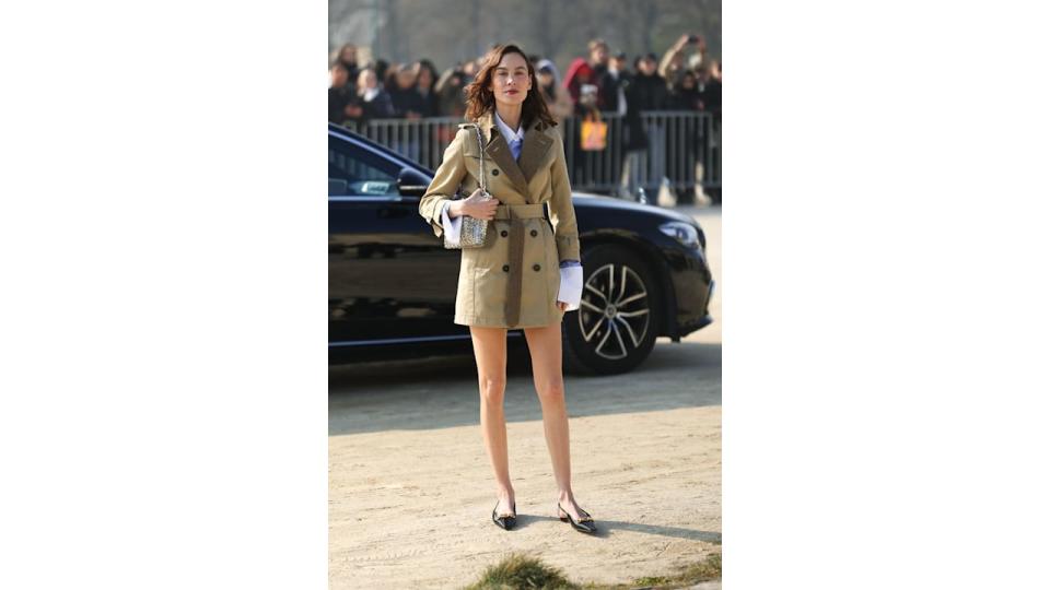 Alexa Chung paired hers with a short trench coat at Loewe's FW23 show