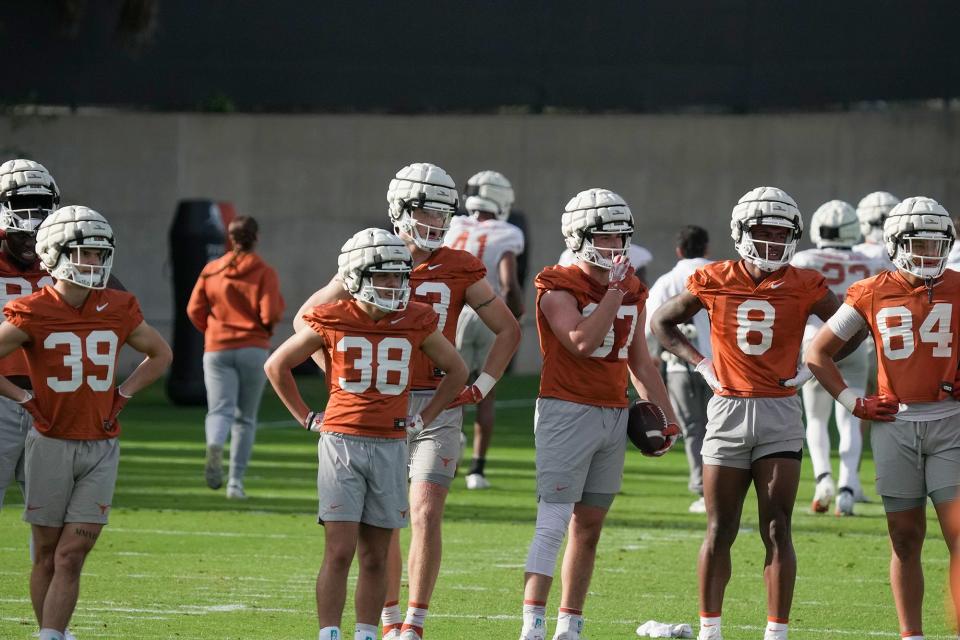 Texas players went through their first practice of spring football workouts Tuesday at Denius Field. The annual Orange-White spring game is April 20 at Royal-Memorial Stadium.