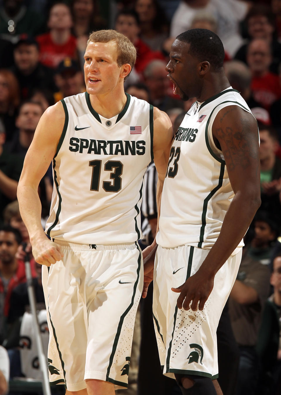 INDIANAPOLIS, IN - MARCH 11: (L-R) Austin Thornton #13 and Draymond Green #23 of the Michigan State Spartans celebrate against the Ohio State Buckeyes during the Final Game of the 2012 Big Ten Men's Conference Basketball Tournament at Bankers Life Fieldhouse on March 11, 2012 in Indianapolis, Indiana. Michigan St. won 68-64. (Photo by Jonathan Daniel/Getty Images)