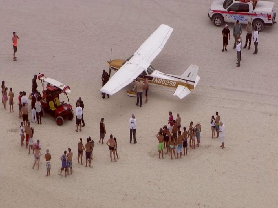 A single-engine plane made an emergency landing on Miami Beach near Collins Avenue and 58th Street on July 29, 2014.