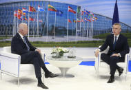 NATO Secretary General Jens Stoltenberg speaks with U.S. President Joe Biden during a bilateral meeting on the sidelines of a NATO summit at NATO headquarters in Brussels, Monday, June 14, 2021. U.S. President Joe Biden is taking part in his first NATO summit, where the 30-nation alliance hopes to reaffirm its unity and discuss increasingly tense relations with China and Russia, as the organization pulls its troops out after 18 years in Afghanistan. (Stephanie Lecocq, Pool via AP)