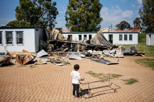 A young member of the 'Coloured' community stands in the courtyard of Oakdale Secondary School in Eldorado Park, on the outskirts of Johannesburg. Several classrooms were destroyed during a student strike in April