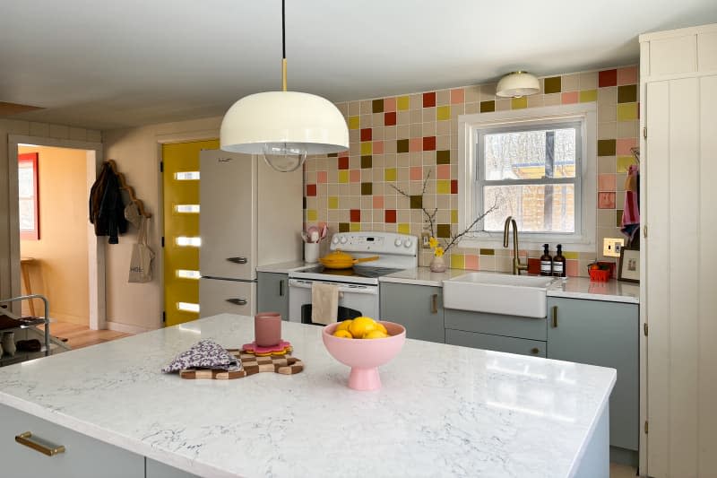 View into newly renovated colorful kitchen.