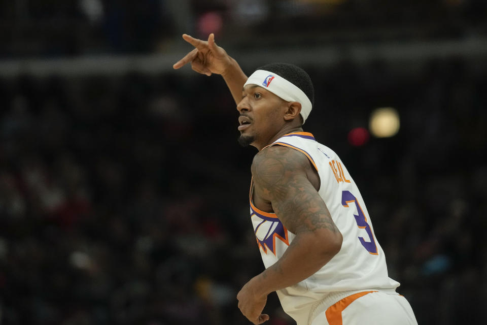 Phoenix Suns guard Bradley Beal holds up three fingers after sinking a three-point shot during the first half of an NBA basketball game against the Chicago Bulls, Wednesday, Nov. 8, 2023, in Chicago. (AP Photo/Erin Hooley)