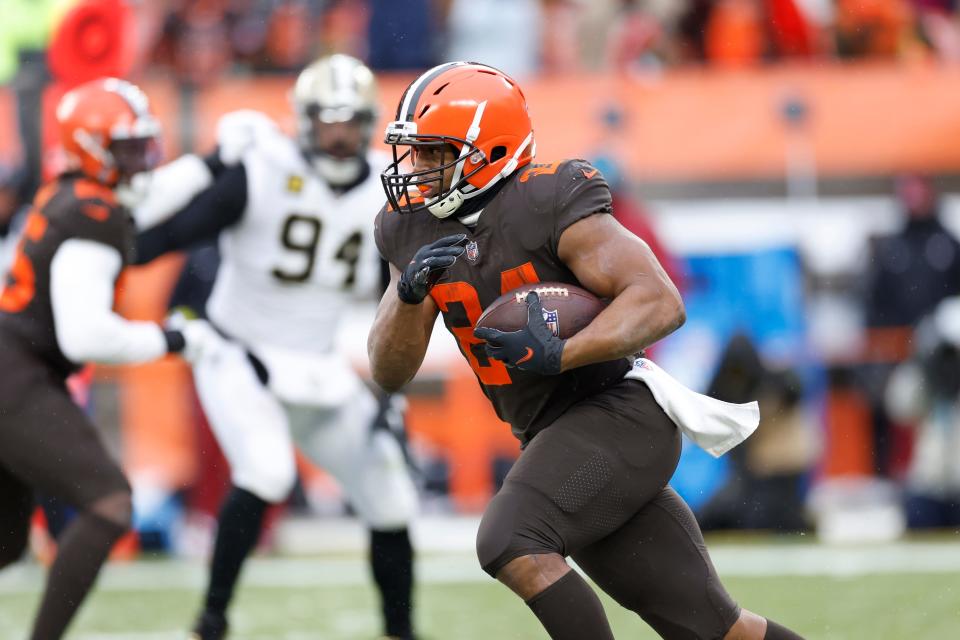 Cleveland Browns running back Nick Chubb (24) rushes during the second half of an NFL football game against the New Orleans Saints, Saturday, Dec. 24, 2022, in Cleveland. (AP Photo/Ron Schwane)