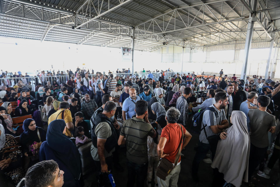 RAFAH, GAZA - NOVEMBER 01: Palestinians with foreign passports at Rafah Border Gate wait to cross into Egypt as the Israeli airstrikes continue on 26th day in Rafah, Gaza on November 01, 2023. (Photo by Abed Rahim Khatib/Anadolu via Getty Images)