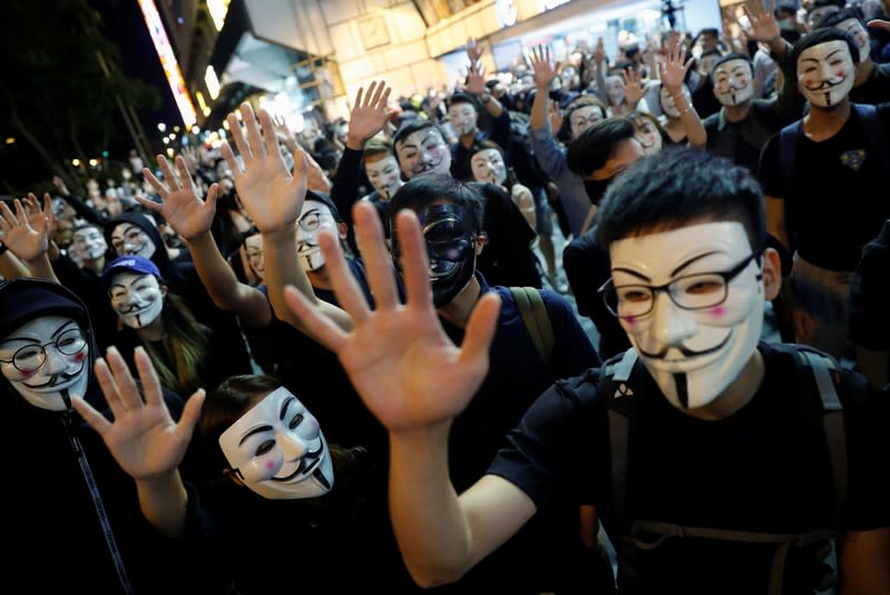 Anti-government protesters take part in a Guy Fawkes-themed march in Hong Kong