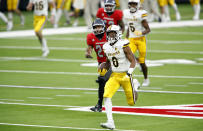 Wyoming running back Xazavian Valladay (6) runs for a 78-yard touchdown run against UNLV during an NCAA college football game in Las Vegas on Friday, Nov. 27, 2020. (Steve Marcus/Las Vegas Sun via AP)