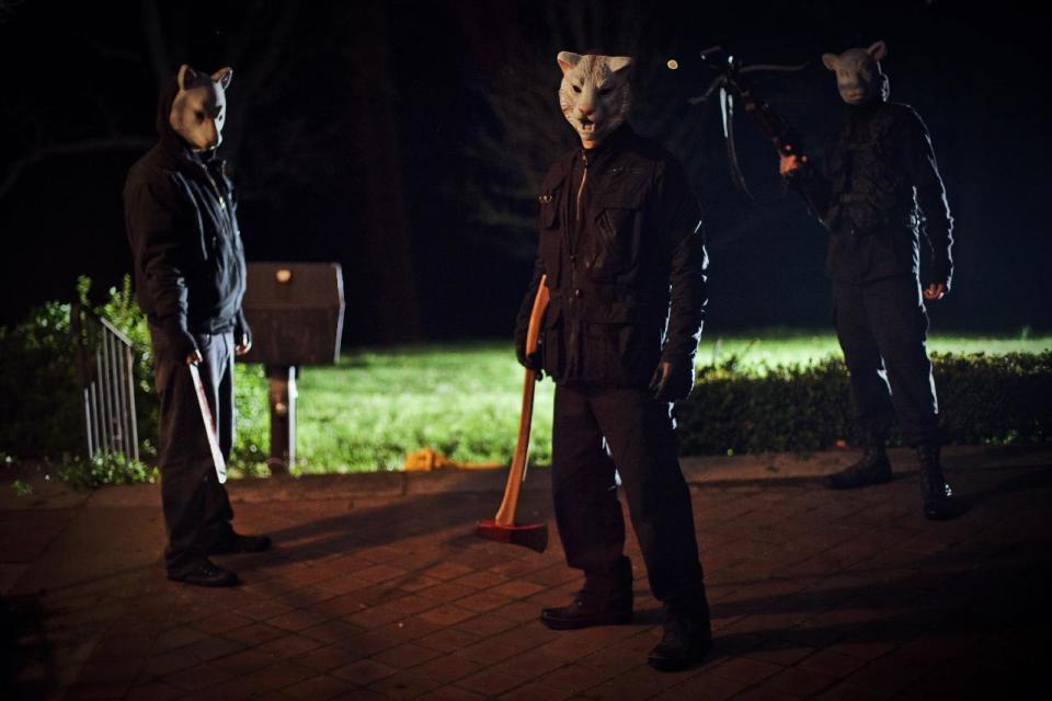 This film publicity image released by Lionsgate shows a scene from "You're Next." (AP Photo/Lionsgate, Corey Ransberg)