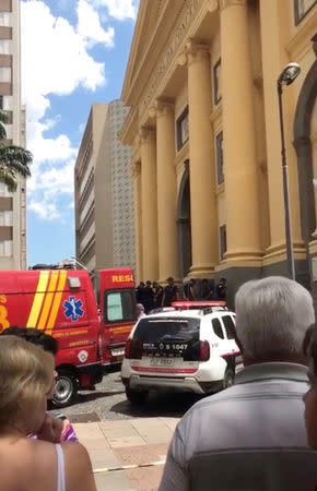 Emergency services are seen outside of Campinas Cathedral in Campinas, Brazil December 11, 2018 in this still image taken from a video obtained from social media. NATALIA PIASSENTINI/via REUTERS