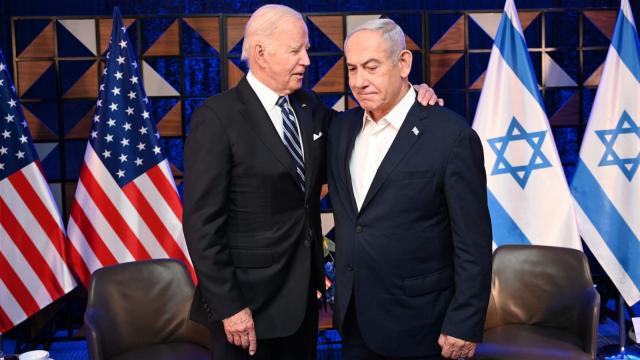 President Joe Biden greets the Washington Nationals' Racing