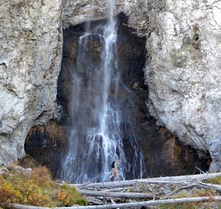 Hiker at Fairy Falls in Yellowstone National Park