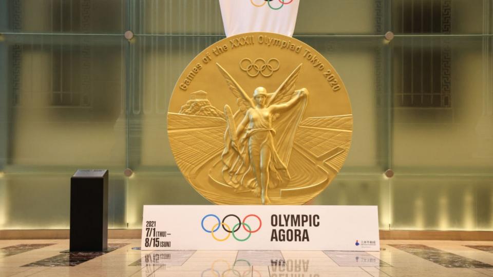 Large replica of the gold medal Tokyo Olympic winners will receive at the current games. 
