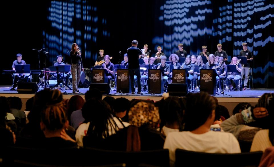 Luisa Schwarz sings while Frank Kroll directs the Max Planck Gymnasium Big Band, a group of high school aged students from Schorndorf, Germany, as they perform for students at Paul Bryant High in Cottondale Monday, Oct. 16, 2023. The visit is part of the Sister Cities program.