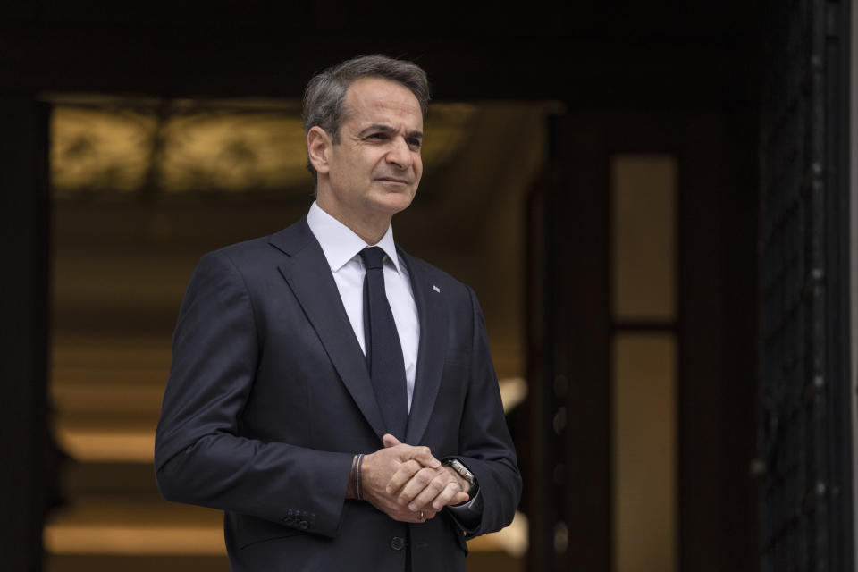 Greek Prime Ministers Kyriakos Mitsotakis looks on as he waits for the arrival of Cyprus' new President Nikos Christodoulides before their meeting in Athens, on Monday, March 13, 2023. (AP Photo/Petros Giannakouris)