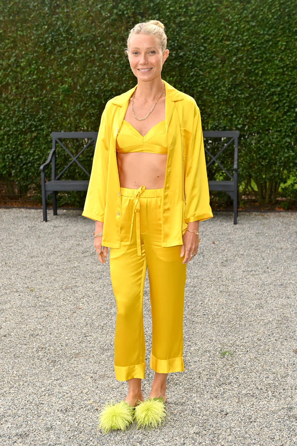 Full length photo of Gwyneth Paltrow wearing yellow pyjamas at Goopglow event. (Getty Images for Goop)