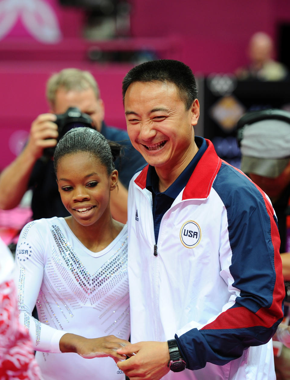 LONDON, ENGLAND - AUGUST 07: Gabrielle Douglas of the United States hugs her coach Liang Chow after she competes on the beam during the Artistic Gymnastics Women's Beam final on Day 11 of the London 2012 Olympic Games at North Greenwich Arena on August 7, 2012 in London, England. (Photo by Michael Regan/Getty Images)