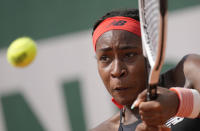 United States's Coco Gauff plays a return to China's Qiang Wang during their second round match on day 5, of the French Open tennis tournament at Roland Garros in Paris, France, Thursday, June 3, 2021. (AP Photo/Christophe Ena)