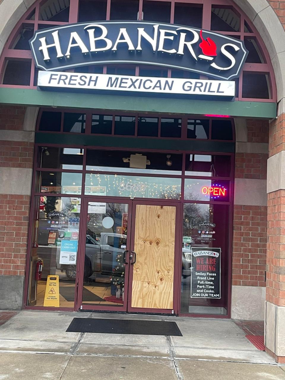 Staff at Habaneros had to board up a door that a suspect smashed through. (Courtesy Photo/Habaneros Fresh Mexican Grill)