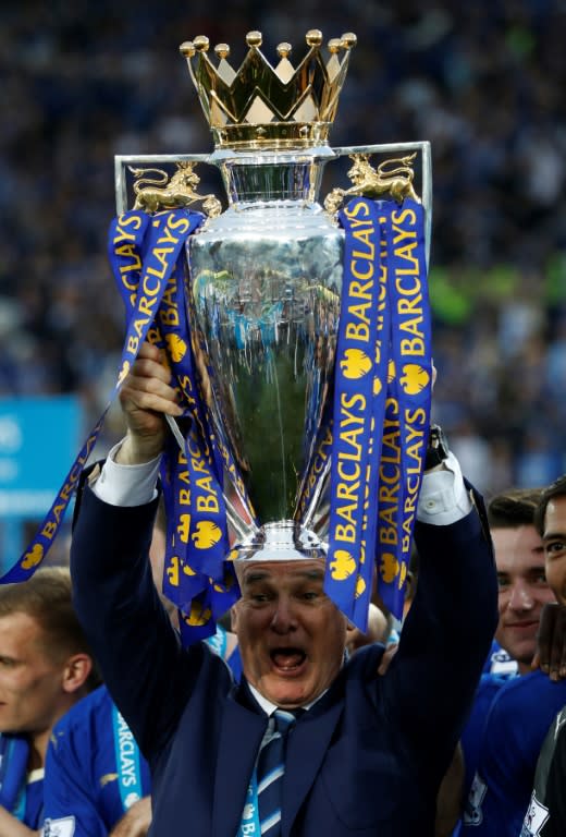 Claudio Ranieri poses with the Premier League trophy in May 2016