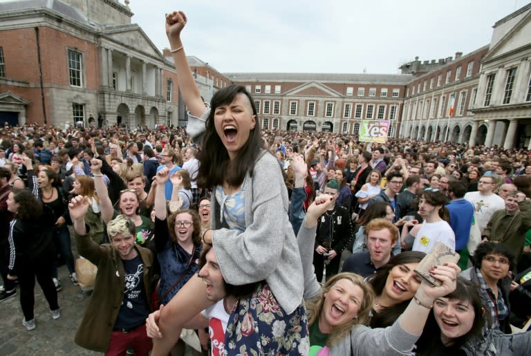 "Yes" campaigners in Dublin Castle's forecourt celebrate the historic referendum result