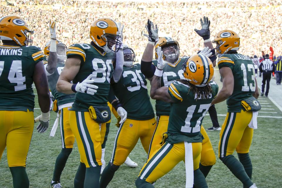 Green Bay Packers' Davante Adams celebrates his touchdown catch with teammates during the first half of an NFL football game against the Chicago Bears Sunday, Dec. 15, 2019, in Green Bay, Wis. (AP Photo/Matt Ludtke)