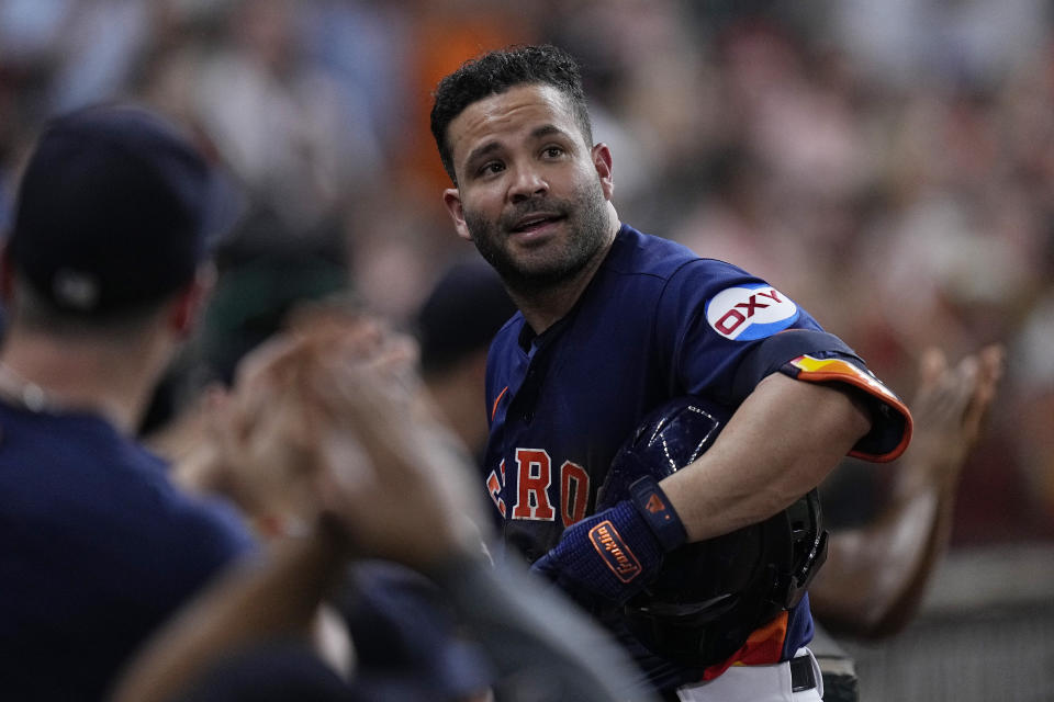 Houston Astros' Jose Altuve takes a curtain call after his 2,000th career hit during the fifth inning of a baseball game against the Seattle Mariners, Saturday, Aug. 19, 2023, in Houston. (AP Photo/Kevin M. Cox)