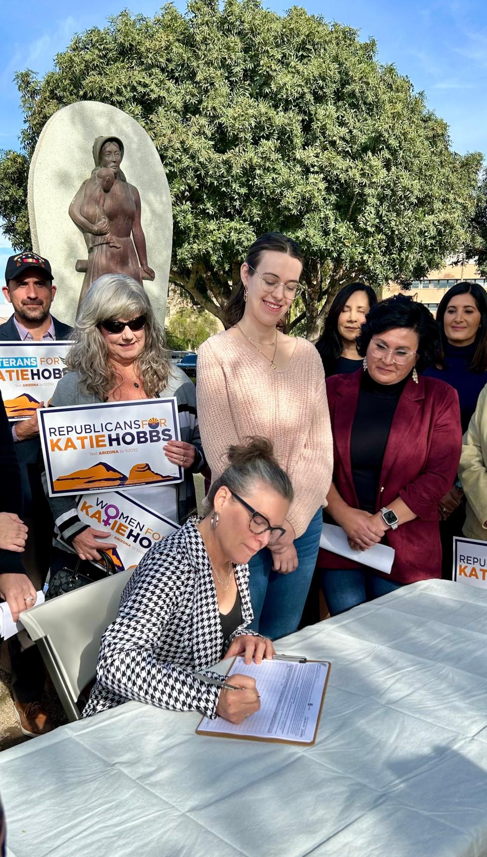 As her daughter Hannah Goodman looked on, Arizona Gov. Katie Hobbs on Nov. 28, 2023, signed a petition for a November 2024 ballot initiative that would enshrine the right to an abortion into the Arizona Constitution.