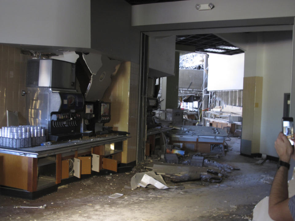 This photo taken Thursday, July 11, 2019 shows some of the damage in the first-floor cafeteria at a University of Nevada, Reno dormitory where a July 5 natural gas explosion blew out walls and windows. School officials gave members of the media their first up-close look at the exterior and interior damage on Thursday. Only eight people suffered minor injuries in the explosion at the mostly empty dorm. (AP Photo/Scott Sonner)