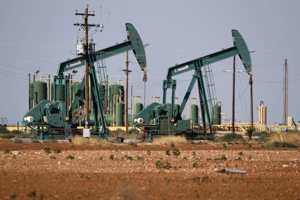 In this Wednesday, July 29, 2020 file photo, a view of a pump jack operateing in an oil field in Midland, Texas.