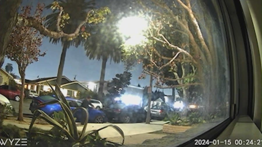 Security footage shows the man breaking the window of a vehicle parked outside the Gladys Avenue condo complex in Long Beach. Residents spoke with KTLA on April 6, 2024. (KTLA)