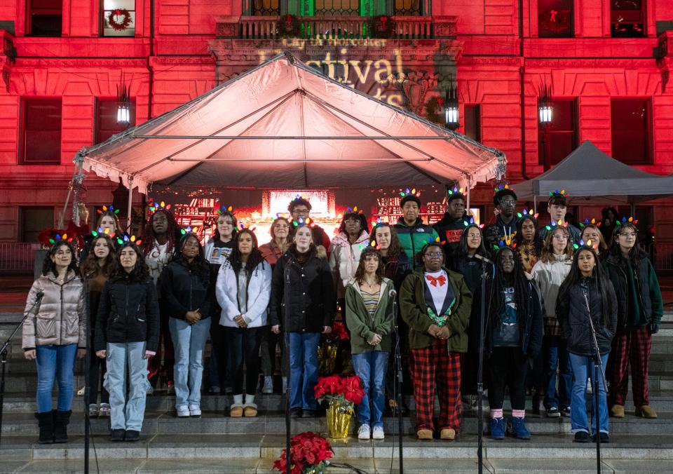 The Burncoat High School Quadrivium Chorus performs on the steps of City Hall during the annual Festival of Lights on Friday.