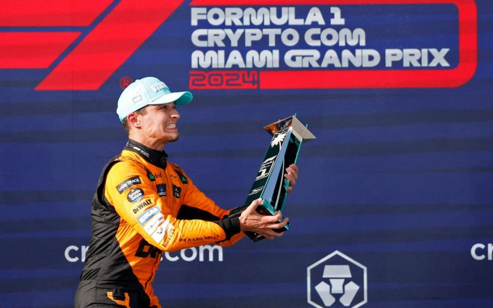 Lando Norris with his winning trophy on the podium