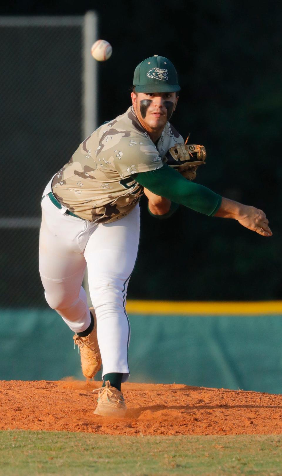 Starting pitcher Kevin Martinez serves a pitch in the second inning. The Island Coast Gators baseball team defeated Miami Springs 4-1 in the  Class 4A-Region 4 Championship game Tuesday, May 17, 2022. The Gators move on to the state semi-finals game. 