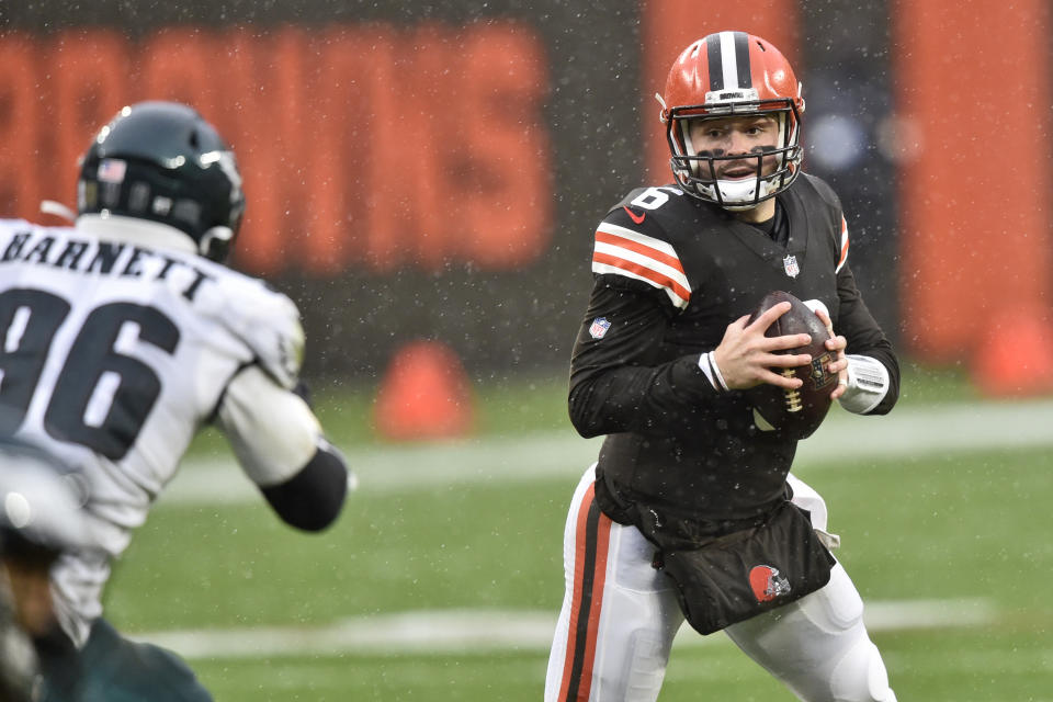 Cleveland Browns quarterback Baker Mayfield (6) tries to avoid Philadelphia Eagles defensive end Derek Barnett (96) during the first half of an NFL football game, Sunday, Nov. 22, 2020, in Cleveland. (AP Photo/David Richard)