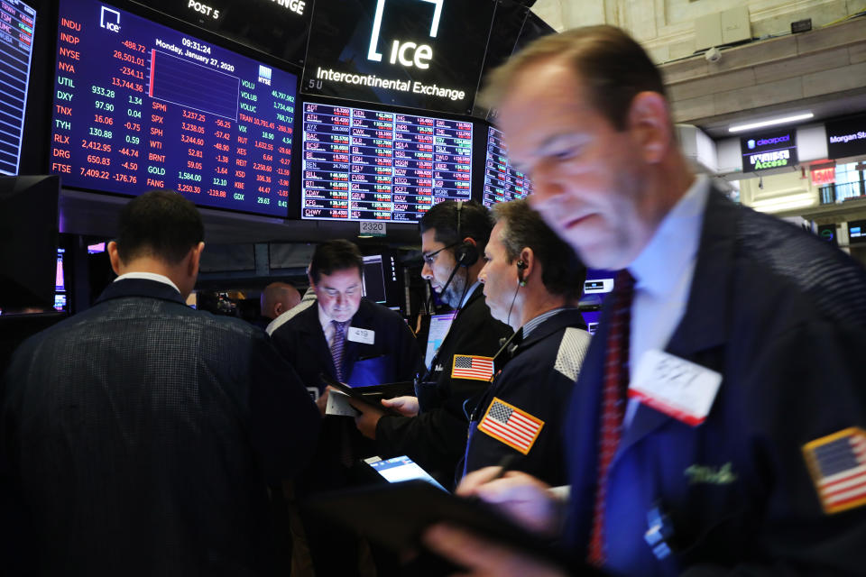 NEW YORK, NEW YORK - JANUARY 27: Traders work on the floor of the New York Stock Exchange (NYSE) on January 27, 2020 in New York City. U.S. stocks fell sharply in morning trading as fears over the spreading coronavirus continue to unsettle global markets. The Dow Jones Industrial Average fell over 400 points after the Opening Bell.  (Photo by Spencer Platt/Getty Images)