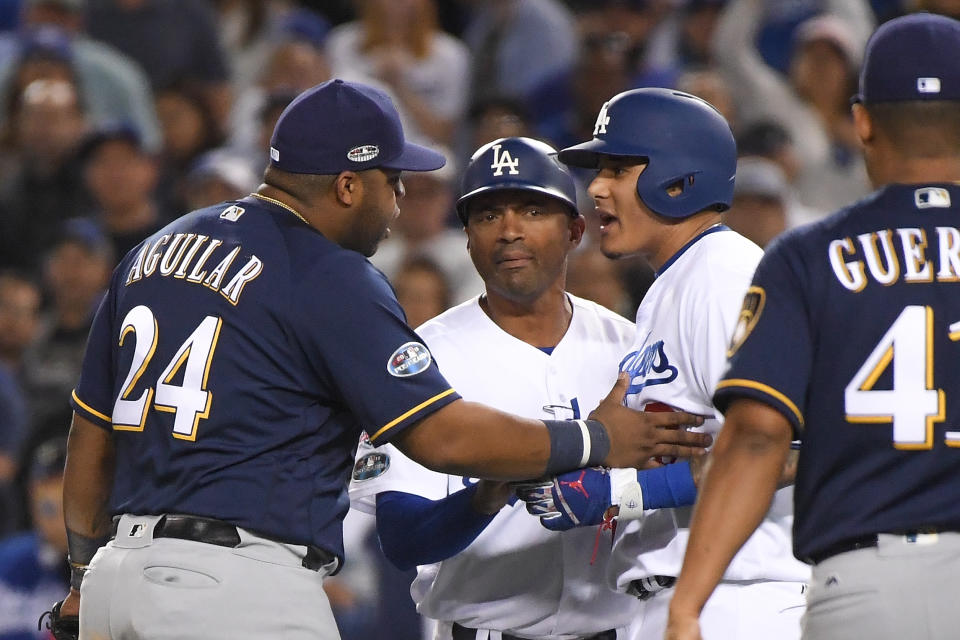 Manny Machado argues with Jesus Aguilar during NLCS Game 4 at Dodger Stadium. (Getty Images)